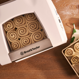 Top-down view of the folding proofer with cinnamon rolls proofing inside.